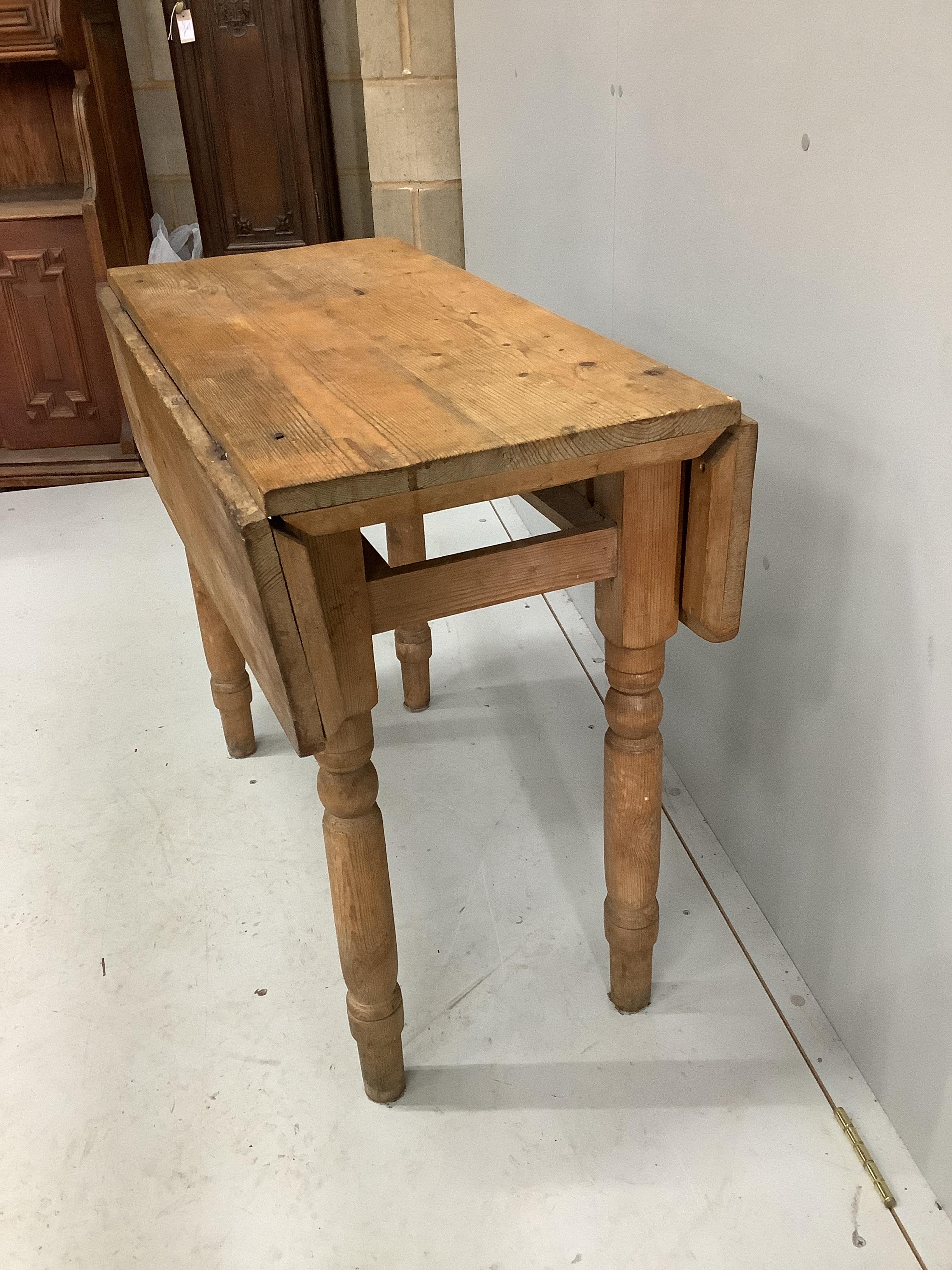 A Victorian pine drop flap table, width 89cm, depth 42cm, height 74cm (missing drawer)